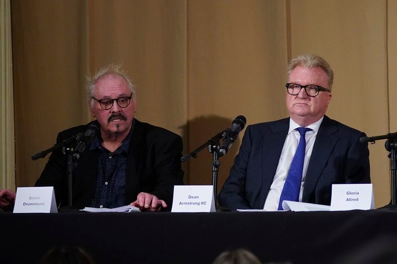 Members of the legal team, barrister Bruce Drummond, left, and Dean Armstrong KC, who featured in 'Al-Fayed: Predator at Harrods', hold a press conference to discuss their involvement in the investigation and the legal claim against Harrods for failing to provide a safe system of work for their employees, at Kent House in Knightsbridge, London, Friday Sept. 20, 2024. Multiple ex-Harrods employees have accused Mohamed Al Fayed, the Egyptian billionaire who owned the luxury department store for more than 25 years, of rape and sexual assault. (Yui Mok/PA via AP)