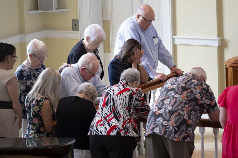 People come to the alter to pray at the end of service at Winder First United Methodist Church in Winder on Sunday, Sept. 8, 2024, the first Sunday following the shootings at Apalachee High School.  Ben Gray for the Atlanta Journal-Constitution