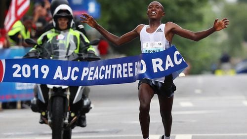 Rhonex Kipruto wins the 50th AJC Peachtree Road Race with an unofficial record time of 27:01 on Thursday, July 4, 2019, in Atlanta.  Curtis Compton/ccompton@ajc.com