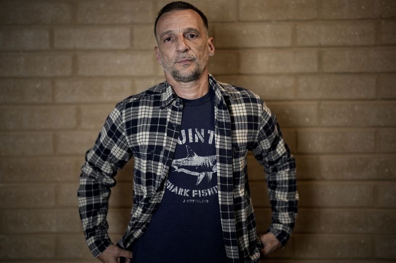 HOLD TO GO WITH ENT LA HAINE MUSICAL Kassovitz poses after an interview with Associated Press, in Tremblay-en-France, Tuesday, Sept. 17, 2024. (AP Photo/Christophe Ena)