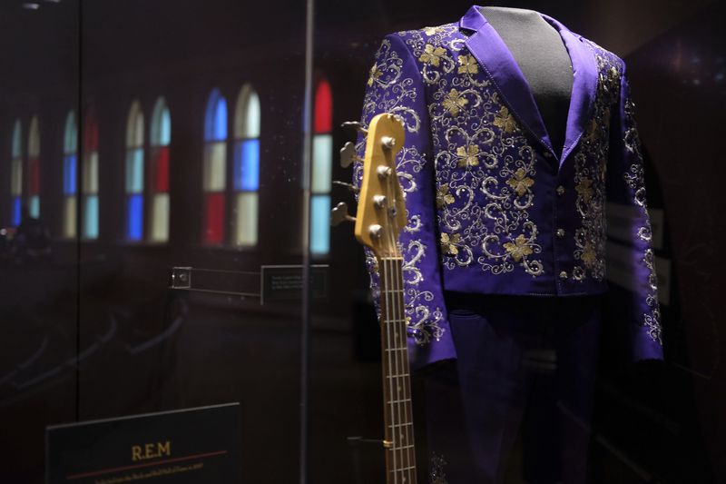 Instruments and clothing worn by artists are displayed at the Ryman Auditorium in Nashville, Tenn., on July 30, 2024. (AP Photo/Luis Andres Henao)