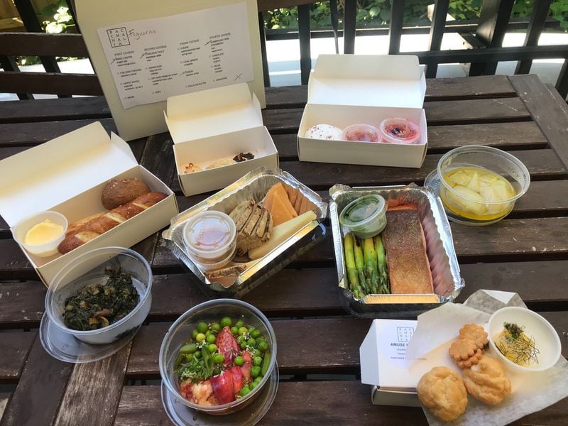 A takeout order from Bacchanalia includes butter and rolls, an amuse bouche, four courses, extra side dishes, and mignardises (sweet, meal-ending nibbles). LIGAYA FIGUERAS / LIGAYA.FIGUERAS@AJC.COM