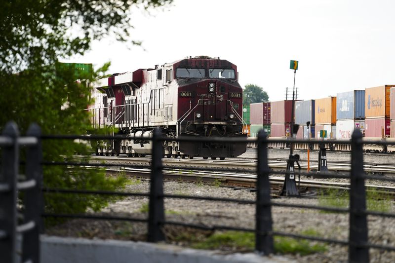 Trains sit idle at a Canadian Pacific Kansas City (CPKC) rail yard in Smiths Falls, Ont., on Thursday, Aug. 22, 2024. (Sean Kilpatrick /The Canadian Press via AP)