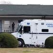 The GBI and local police agencies work at Cielo Azulak Apartments on Feb. 23 in Athens. (Jason Getz / jason.getz@ajc.com)