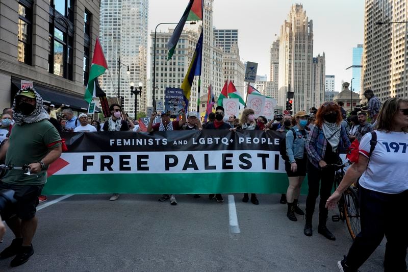 Protesters march prior to the start of the Democratic National Convention Sunday, Aug. 18, 2024, in Chicago. (AP Photo/Alex Brandon)