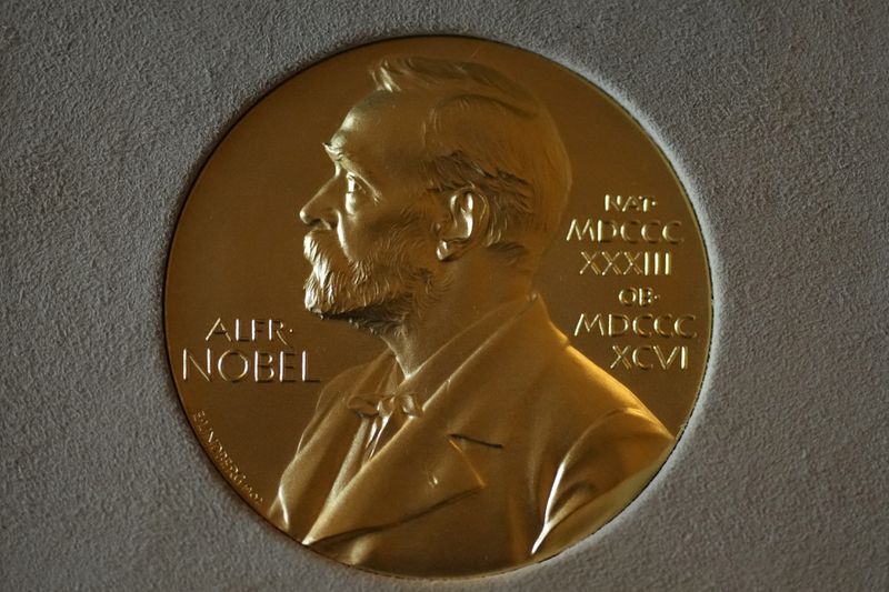 FILE - A Nobel Prize medal is displayed before a ceremony at the Swedish Ambassador's Residence in London, Monday, Dec. 6, 2021. (AP Photo/Matt Dunham, File)