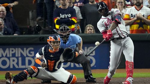 FILE - Atlanta Braves' Jorge Soler hits a three-run home run during the third inning in Game 6 of baseball's World Series between the Houston Astros and the Atlanta Braves Tuesday, Nov. 2, 2021, in Houston. The Braves would love to see him recreate that magic as they prepare for another postseason run by continuing to reunite members of that championship team. (AP Photo/Sue Ogrocki, File)