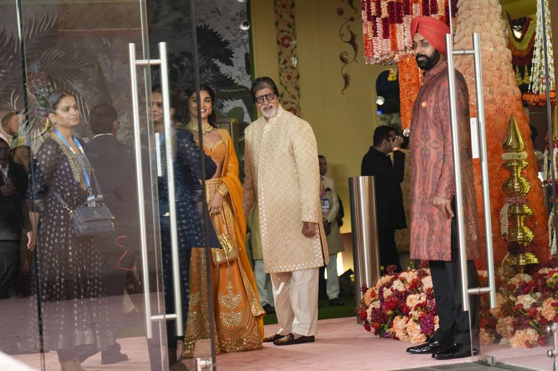 Indian actor Amitabh Bachchan arrives at the wedding of Billionaire Mukesh Ambani's son Anant Ambani and Radhika Merchant at Jio World Convention Centre in Mumbai, India, Friday, July 12, 2024. (AP Photo /Rajanish Kakade)