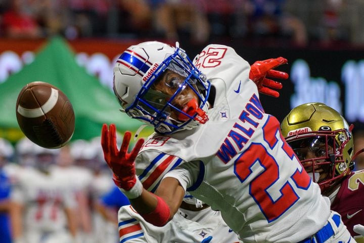 Walton’s MJ Burnett reaches for the football during the game against Brookwood during the Corky Kell Classic at Mercedes-Benz Stadium on Saturday. Walton won 30-21. (Jamie Spaar for the Atlanta Journal Constitution)