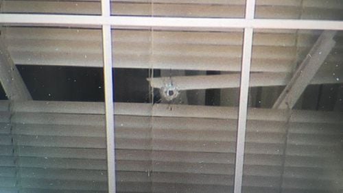 A bullet hole found after two 11-year-old girls were shot during a sleepover in Newnan. (Credit: Channel 2 Action News)