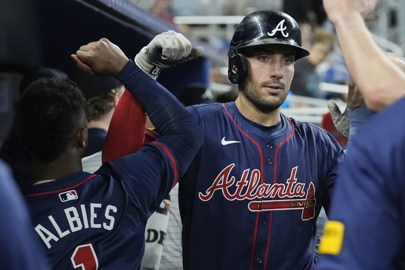 Atlanta Braves' Matt Olson celebrates a two-run home run during the seventh inning of a baseball game against the Miami Marlins, Saturday, Sept. 21, 2024, in Miami. (AP Photo/Marta Lavandier)