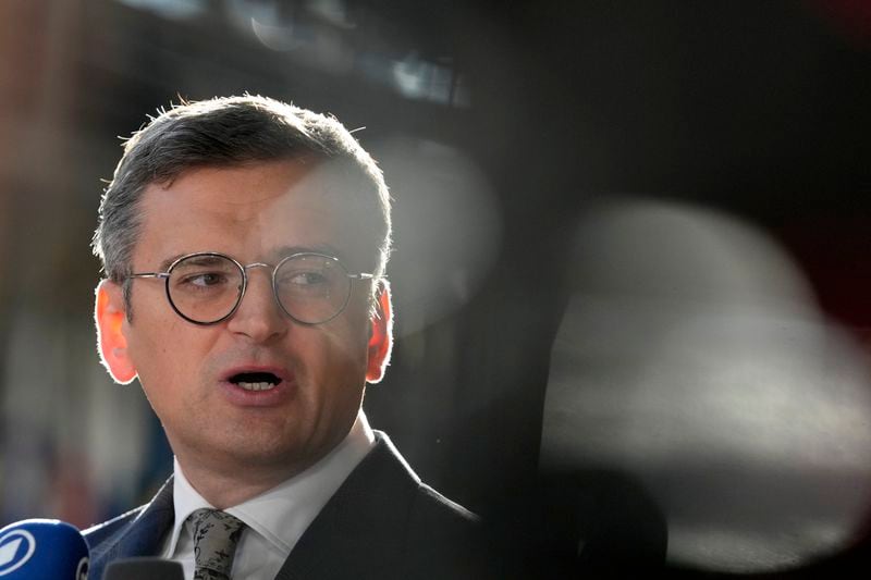 Ukraine's Foreign Minister Dmytro Kuleba speaks with the media as he arrives for a meeting of EU foreign ministers at the European Council building in Brussels, Thursday, Aug. 29, 2024. (AP Photo/Virginia Mayo)