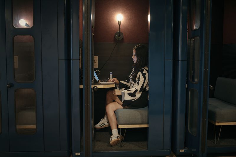 Entrepreneur Becky Litvintchouk works on her computer at a co-working space on Monday, Aug. 12, 2024, in New York. (AP Photo/Andres Kudacki)