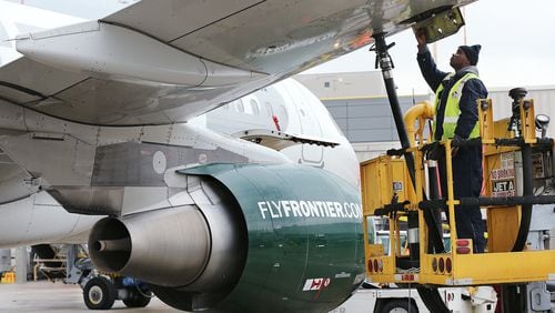 A Frontier Airlines plane is fueled before departing Hartsfield-Jackson International Airport in 2016.