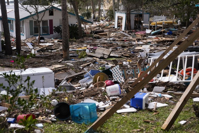 FILE - Destruction to the Faraway Inn Cottages and Motel is visible in the aftermath of Hurricane Helene, in Cedar Key, Fla., Sept. 27, 2024. (AP Photo/Gerald Herbert, File)