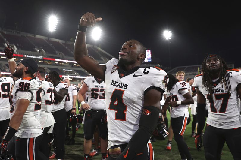 Oregon State quarterback Gevani McCoy reacts after winning against San Diego State at the end of an NCAA college football game Saturday, Sept. 7, 2024, in San Diego. (AP Photo/Raul Romero Jr.)