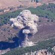 Smoke rises from an Israeli airstrike on the Mahmoudieh mountain, as seen from Marjayoun town, south Lebanon, Tuesday, Sept. 24, 2024. (AP Photo/Hussein Malla)