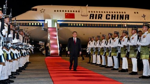 In this photo released by Malaysia's Department of Information, China's Premier Li Qiang arrives at Sepang International Airport in Kuala Lumpur, Malaysia, Tuesday, June 18, 2024. (Malaysia's Department of Information via AP)