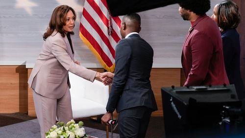 Democratic presidential nominee Vice President Kamala Harris, left, shaking hands with Gerren Keith Gaynor, center, as Eugene Daniels, second from the right, and Tonya Mosley, far right, look on after being interviewed by the National Association of Black Journalists at the WHYY studio in Philadelphia, Tuesday, Sept. 17, 2024. (AP Photo/Jacquelyn Martin)