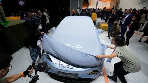 FILE - Chinese EV manufacturer BYD unveils its electric car Seal at the Paris Car Show on Oct. 17, 2022, in Paris. (AP Photo/Michel Euler, File)