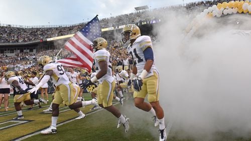 September 3, 2015 Atlanta - Georgia Tech players run on to the field before the start of the Georgia Tech season opener against the Alcorn State Braves in Bobby Dodd Stadium on Thursday, September 3, 2015. HYOSUB SHIN / HSHIN@AJC.COM