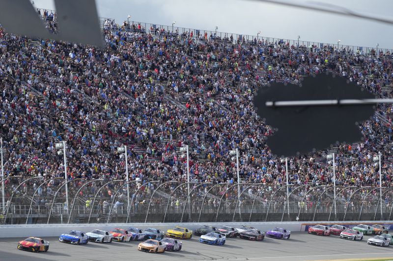 Drivers drive during a NASCAR Cup Series auto race at Michigan International Speedway, Sunday, Aug. 18, 2024, in Brooklyn, Mich. (AP Photo/Carlos Osorio)