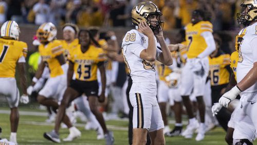 Missouri celebrates behind Vanderbilt place kicker Brock Taylor (88) after he missed a field goal during overtime of an NCAA college football game as Missouri celebrates Saturday, Sept. 21, 2024, in Columbia, Mo. (AP Photo/L.G. Patterson)