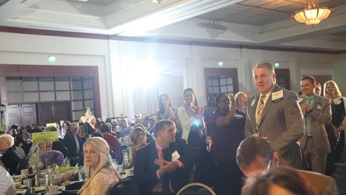 Described by one of his nominators as a “nurse’s nurse,” WellStar’s Stuart Downs walks up to receive his award at the Celebrating Nurses luncheon in May.