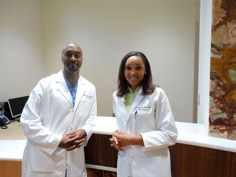 Dr. Marcus Crawford and Dr. Aisha McKnight-Baron work at Crawford Plastic Surgery in Kennesaw. CREDIT: Rodney Ho/ rho@ajc.com