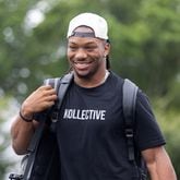 Players arrive at Flowery Branch: Running back Bijan Robinson smiles as he reports to Falcons’ headquarters Wednesday for the start of the team's training camp. (Arvin Temkar / AJC)