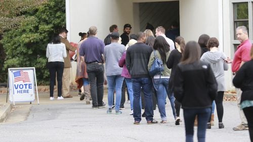 Voters wait to cast their votes at the Life Church Smyrna Assembly of God in Smyrna on Tuesday, Nov. 8, 2016.