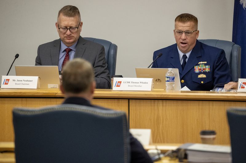 Board Chairman Jason Neubauer, left, and board member Thomas Whalen, of the investigative board for the Titan marine board formal hearing, speak with former OceanGate's Director of Marine Operations David Lochridge, foreground, Tuesday, Sept. 17, 2024, in North Charleston, S.C. (Andrew J. Whitaker/The Post And Courier via AP, Pool)