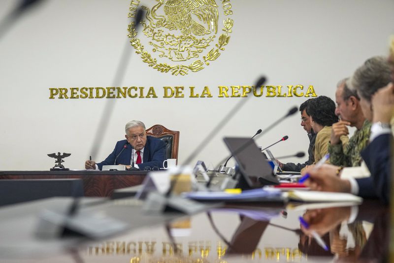 FILE - Mexican President Andres Manuel Lopez Obrador meets with his security cabinet at the National Place in Mexico City, Aug. 2, 2024. (AP Photo/Fernando Llano, File)