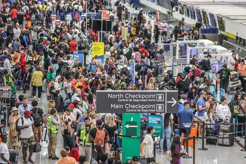 Passengers crowd the Terminal North check-in area at Hartsfield-Jackson International Airport on Friday, July 19, 2024, as a global technology outage impacted airlines, airports and many industries. John Spink/jspink@ajc.com