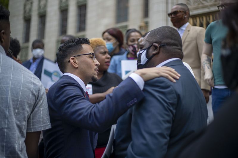 05/14/2021 — Atlanta, Georgia — Atlanta City Councilman Antonio Brown greets a supporter before announcing his bid for Atlanta mayor during a press conference outside of Atlanta City Hall in Atlanta, Friday, May 14, 2021. (Alyssa Pointer / Alyssa.Pointer@ajc.com)