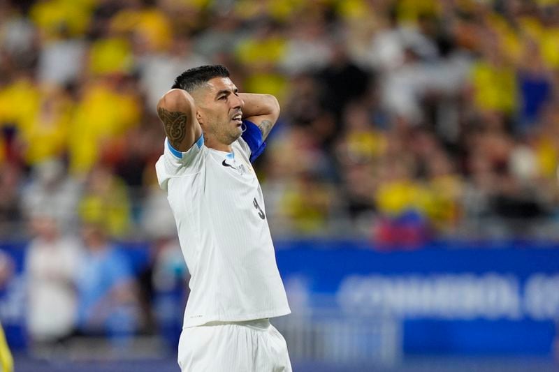 Uruguay's Luis Suarez reacts after missing a chance to score against Colombia during a Copa America semifinal soccer match in Charlotte, N.C., Wednesday, July 10, 2024. (AP Photo/Julia Nikhinson)