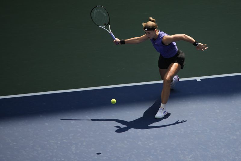 Karolina Muchova, of the Czech Republic, returns a shot to Beatriz Haddad Maia, of Brazil, during the quarterfinals of the U.S. Open tennis championships, Wednesday, Sept. 4, 2024, in New York. (AP Photo/Pamela Smith)