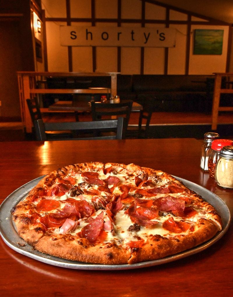 The Sid Vicious pizza at Shorty's includes sausage, ground beef, Black Forest ham, salami and pepperoni. Chris Hunt for The Atlanta Journal-Constitution