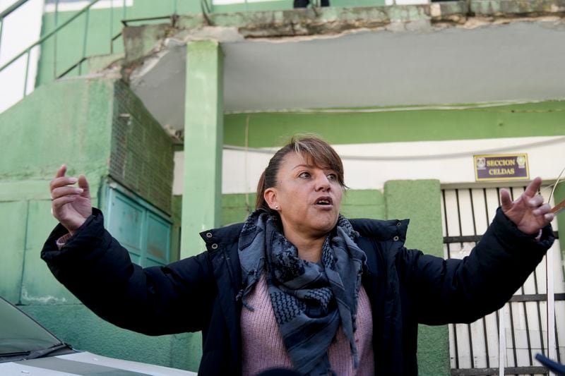 Nubia Human de Barbery stands outside the jail where a relative of hers is being held after his alleged involvement in what President Luis Arce called a coup attempt in La Paz, Bolivia, Friday, June 28, 2024. (AP Photo/Juan Karita)