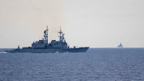 In this photo released by the Taiwan Ministry of National Defense, Taiwan guided missile destroyer Ma Kong DDG1805, left, monitors Chinese guided missile destroyer Xi'an DDG15, right, near Taiwan on Thursday, May 23, 2024. Taiwan tracked dozens of Chinese warplanes and navy vessels off its coast Friday on the second day of a large exercise China's People's Liberation Army held in response to the inauguration of the island's new leadership. (Taiwan Ministry of National Defense via AP)