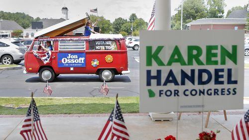 A campaign van for Jon Ossoff passes by a sandwich shop in Dunwoody where Karen Handel had just departed after greeting supporters there. Both are candidates in Georgia’s 6th Congressional District runoff election. BOB ANDRES /BANDRES@AJC.COM