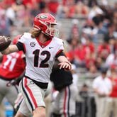 Georgia quarterback Brock Vandagriff (12) attempts a pass during the G - Day game at Sanford Stadium Saturday, April 16, 2022, in Athens, Ga. (Jason Getz / Jason.Getz@ajc.com)