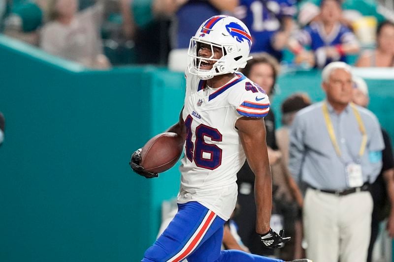 Buffalo Bills cornerback Ja'Marcus Ingram (46) reacts after scoring a touchdown after intercepting a pass during the second half of an NFL football game against the Miami Dolphins, Thursday, Sept. 12, 2024, in Miami Gardens, Fla. (AP Photo/Rebecca Blackwell)