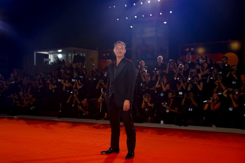 Jude Law poses for photographers upon arrival for the premiere of the film 'The Order' during the 81st edition of the Venice Film Festival in Venice, Italy, on Saturday, Aug. 31, 2024. (Photo by Vianney Le Caer/Invision/AP)