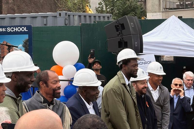 Former New York Knicks basketball players Walt Frazier, second from left without a hard hat, Earl Monroe, center left, Knicks forward Julius Randle, Knicks coach Tom Thibodeau and former Knicks player John Starks attend a groundbreaking ceremony for the Earl Monroe New Renaissance Basketball School, where the basketball court will be named for Randle, Wednesday, Sept. 25, 2024, in New York. (AP Photo Brian Mahoney)