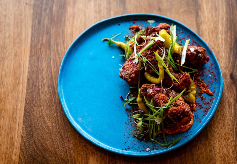 The Crispy Pimentón Chicken at Buena Vida is a play on Nashville hot chicken. CONTRIBUTED BY HENRI HOLLIS