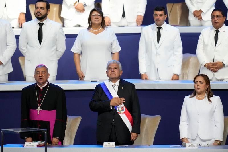New Panamanian President Jose Raul Mulino sings the national anthem at his swearing-in ceremony at the Atlapa Convention Centre in Panama City, Monday, July 1, 2024. (AP Photo/Matias Delacroix)