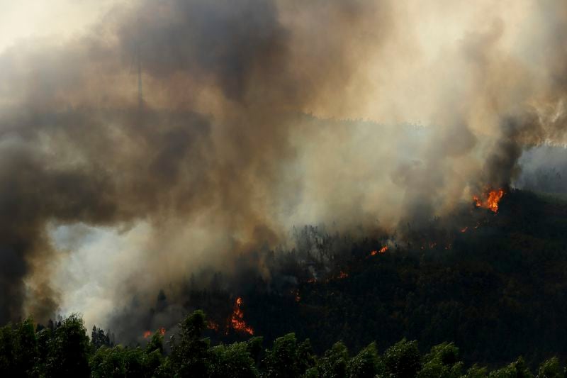 Wildfire advances near Sever do Vouga, a town in northern Portugal that has been surrounded by forest fires, Tuesday, Sept. 17, 2024. (AP Photo/Bruno Fonseca)