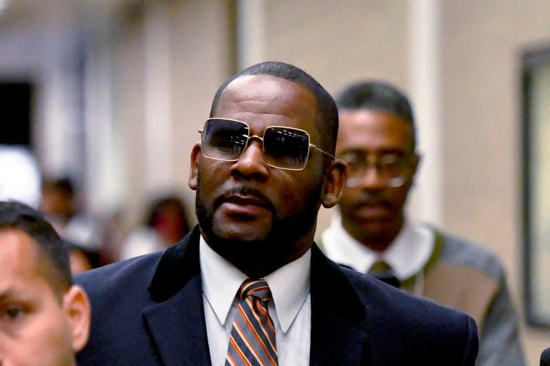 FILE - R. Kelly leaves the Daley Center after a hearing in his child support case, May 8, 2019, in Chicago. (AP Photo/Matt Marton, File)