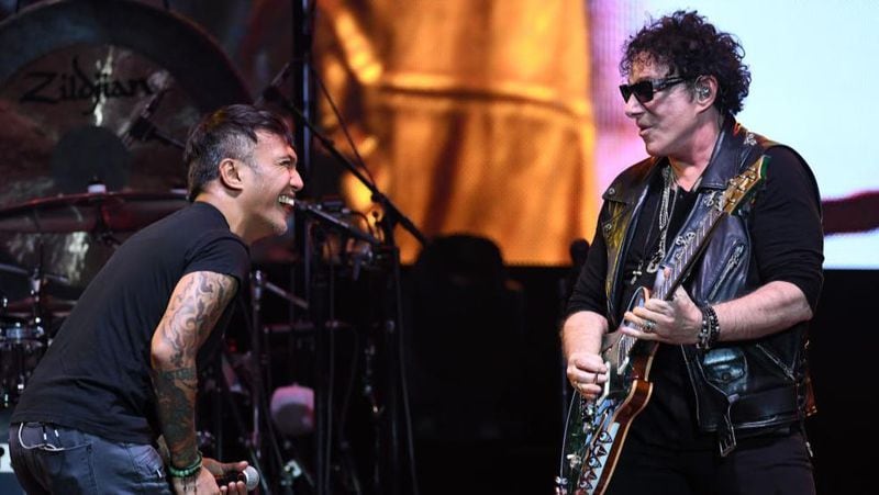 Singer Arnel Pineda (left) and guitarist Neal Schon of Journey perform during the first night of the band's second nine-show residency at The Joint inside the Hard Rock Hotel & Casino on May 3, 2017 in Las Vegas, Nevada.  (Photo by Ethan Miller/Getty Images)